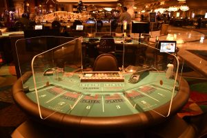 Las Vegas poker rooms move to eight handed tables with plexiglass